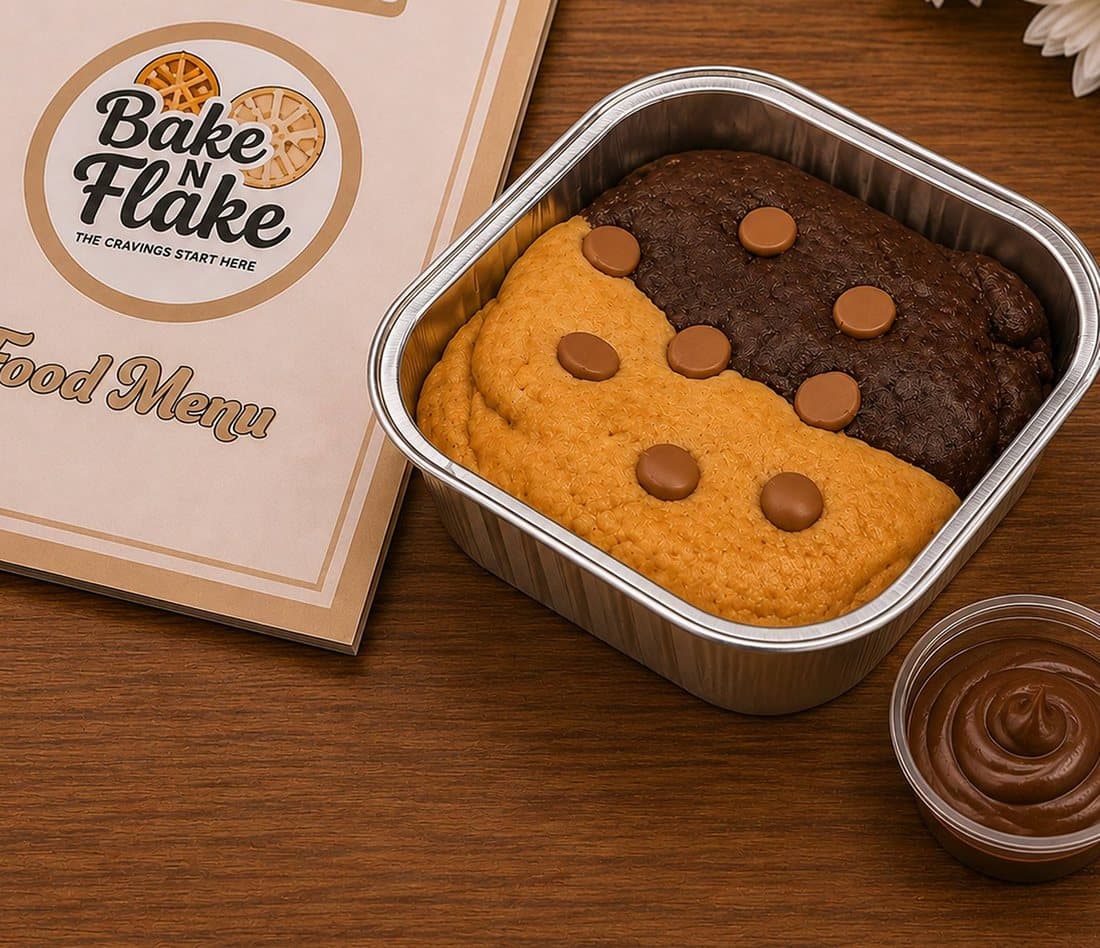 Freshly baked golden artisan cookies on bakery tray from Krishna Nagar kitchen